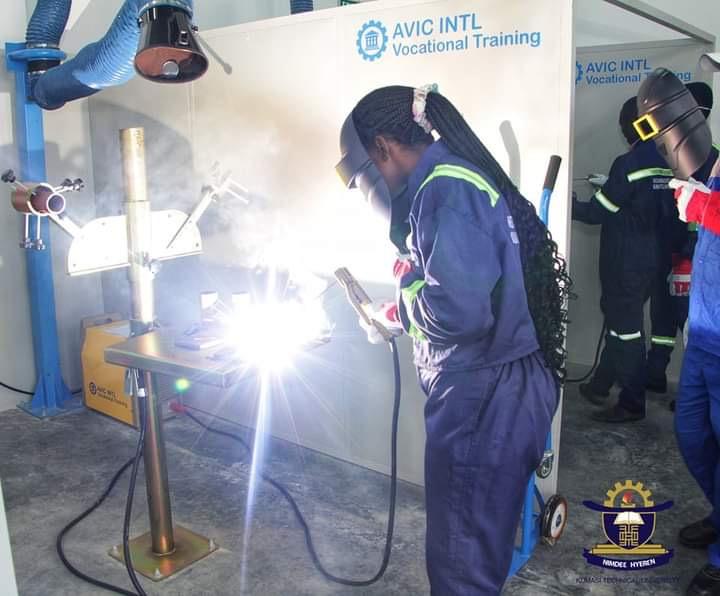 Students from Ghana working on a welding machine at Kumasi Technical University, Ghana.