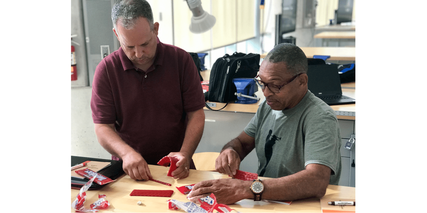 Two e4usa teachers working on a project 